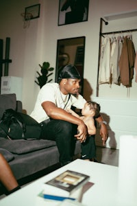 a man and a child sitting on a couch